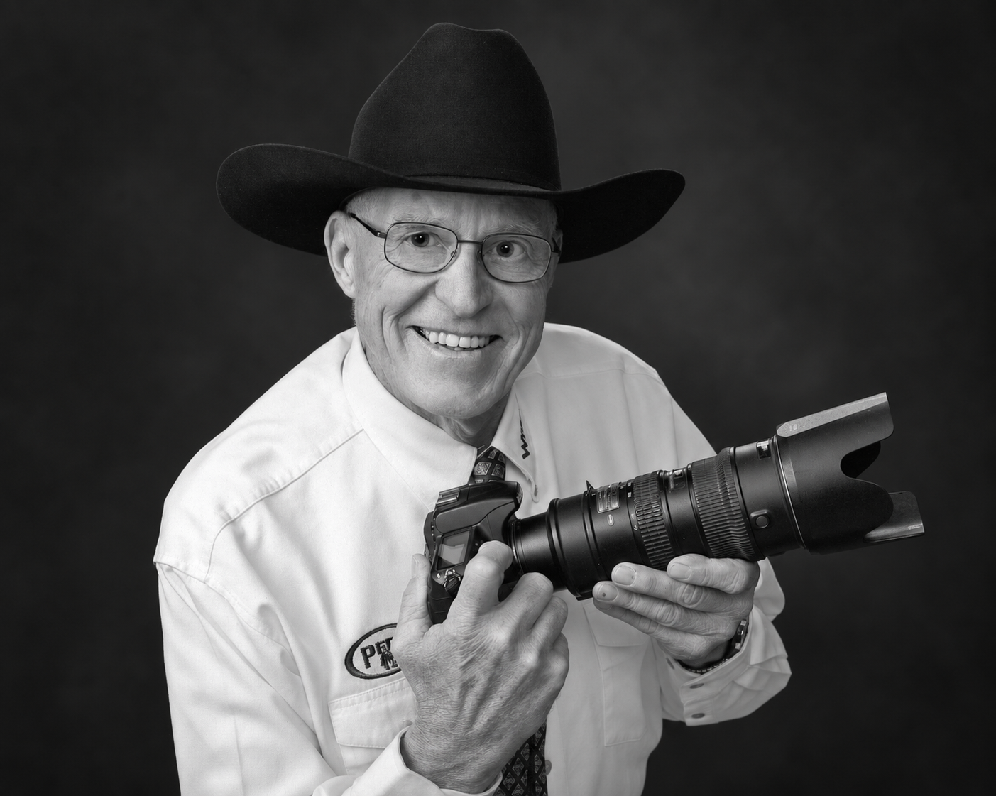 Jim Svoboda smiling and holding his camera